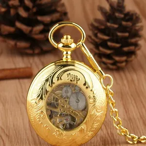 Detailed view of a vintage gold engraved pocket watch with its intricate mechanical movement
