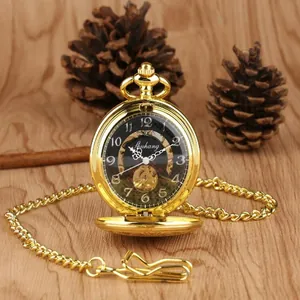 Close-up detail of a vintage gold mechanical skeleton pocket watch with classical chain