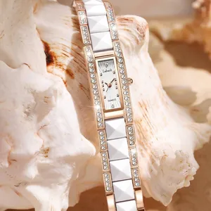 Elegant rectangular women's watch with crystals and a white ceramic bracelet band.