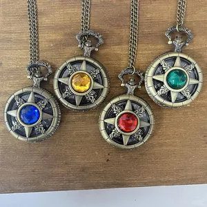 Detail view of bronze quartz pocket watches with colorful gemstones in star design