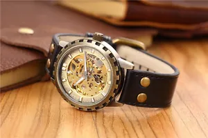 Close-up view of vintage bronze skeleton automatic mechanical watch with gear bezel