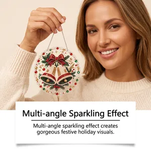 Close-up of sparkling Christmas pearl art diamond painting ornament held by a woman