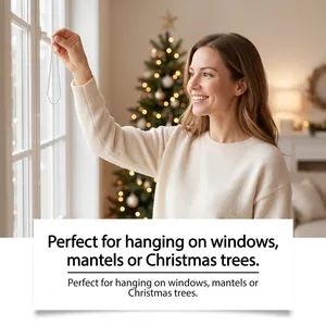 Woman hanging a festive Christmas decoration on a window within a cozy holiday home setting