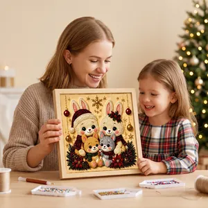 Mother and daughter showing a finished Christmas rabbit pearl diamond painting in a frame