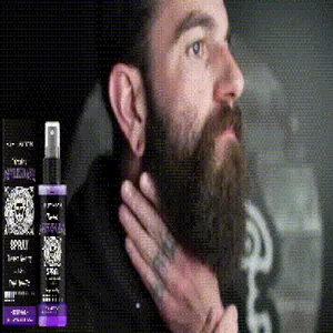 Close-up of East Moon aftershave spray bottle and box on men's grooming scene background.