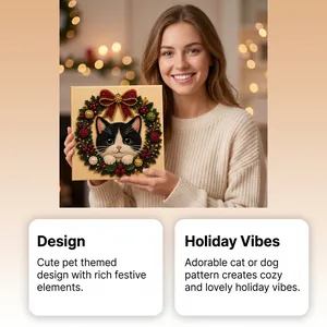 Festive handmade Christmas cat pearl art kit held by a model in a cozy indoor setting