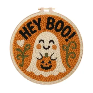 Close-up of Halloween ghost punch needle embroidery with "Hey Boo" text and hoop.