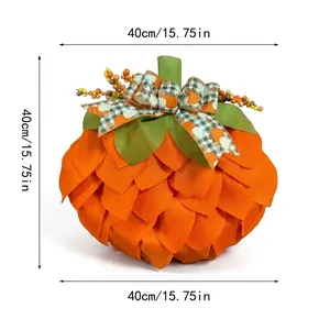 Detailed view of the 15.75 inch orange fabric pumpkin wreath with a checkered bow