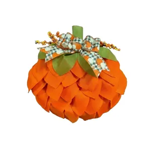 Handmade orange fabric pumpkin decoration with plaid bow for Halloween front door decor