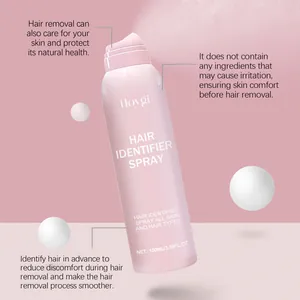 Detailed view of Hoygi hair identifier spray bottle against a pink textured background