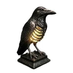 Gothic style raven skeleton lamp with warm glowing ribcage for Halloween table decor