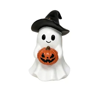 Ceramic Halloween ghost figurine with black witch hat and carved pumpkin lantern ornament