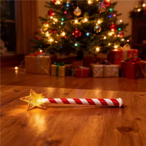 Festive magic wand Christmas light controller with glowing star on a wooden table