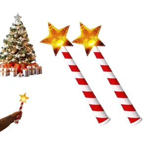 Glowing magic wand Christmas light featuring gold star topper and red white striped wand