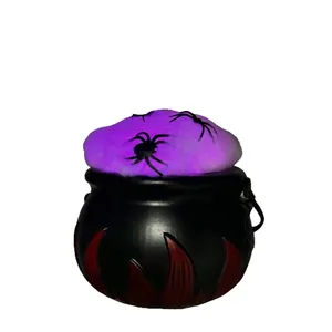 Halloween witch cauldron ornament with black spiders and purple glowing LED light