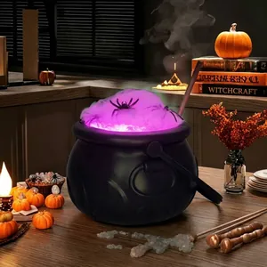 Atmospheric detail of a Halloween witch cauldron with purple lights and spider foam