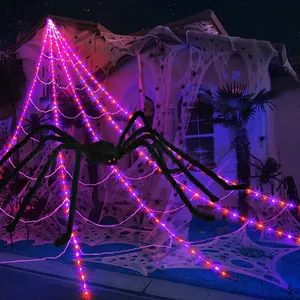 Halloween outdoor decoration with giant plush spider and purple LED light-up triangular web