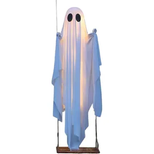 Large hanging white ghost on a swing with LED lights for Halloween outdoor porch decoration