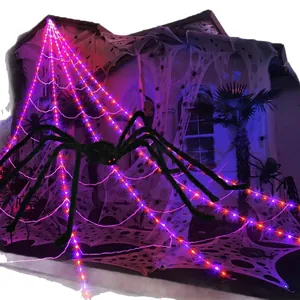 Giant glowing Halloween spider web with LED lights and a large plush spider.