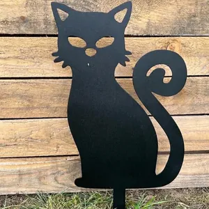 Close-up of a minimalist black metal cat silhouette garden stake for outdoor yard decor