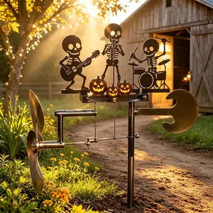 Detail of Halloween skeleton band wind spinner garden stake with pumpkin silhouettes in a yard