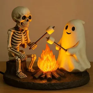 Detailed view of Skeleton and Ghost bonfire night lamp with warm glowing fire effect