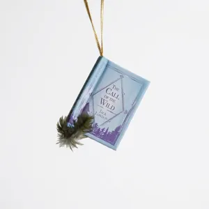 Adorno de libro en miniatura 'The Call of the Wild' con cordón dorado y pluma
