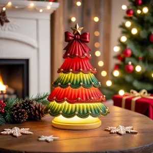 Close-up of a festive Christmas tree lamp with red bow and warm internal lighting