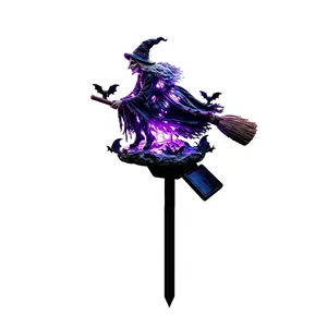Detailed macro view of creative Halloween solar witch garden stake light with purple LED glow