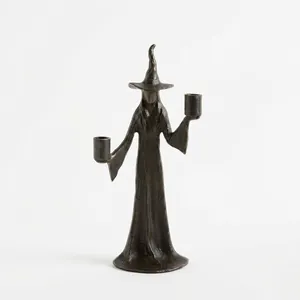 Detailed view of a handmade black witch statue Halloween resin ornament for shelf decor