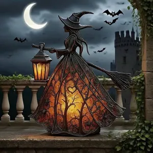Halloween witch lamp with warm orange glowing skirt and mystic castle background detail