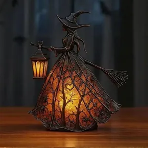 Detailed view of Halloween witch lamp showing intricate tree and spider glowing patterns