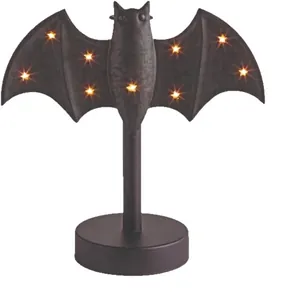 Macro view of Halloween bat desk lamp with star-shaped warm yellow LED lights