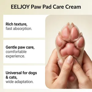 Macro shot of a healthy pink pet paw being massaged with EELJOY paw pad care cream