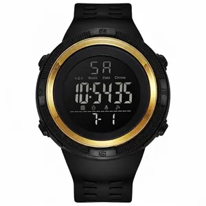Close-up of men's digital sports watch with gold-tone bezel and luminous display