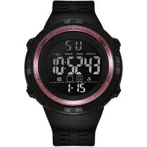 Detail of digital sports watch face with rose gold ring and luminous display