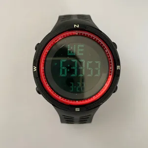 Detailed close-up view of a large dial men's digital sports watch with a stylish red bezel