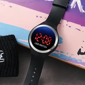 Close-up detail of a stylish black LED digital watch with red display for kids and students