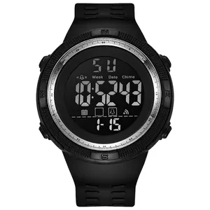 Close-up macro view of a black digital sports watch with luminous date and week display