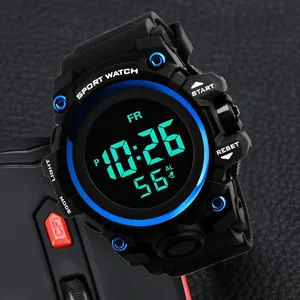 Close-up macro shot of a rugged black digital sport watch with a glowing blue light display
