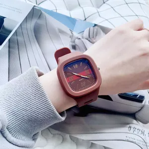 Detailed shot of stylish square quartz watch with brown silicone strap and date