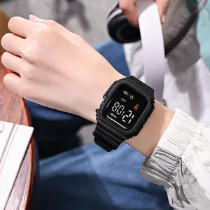 Detailed view of a stylish black square LED digital sports watch worn on a wrist