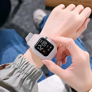 Detailed view of the square LED digital watch worn on a wrist showing clear screen