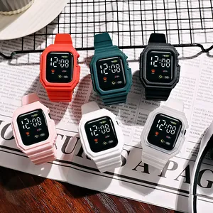 Six colorful square LED digital watches for children on magazine background