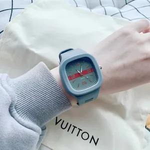 Modern square Klein blue quartz watch shown on wrist with unique striped dial