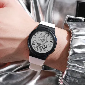 Detailed view of a digital sports watch with astronaut motif and white silicone strap.