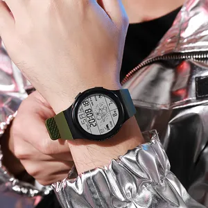 Detail view of a digital astronaut watch with a luminous display on a person's wrist.
