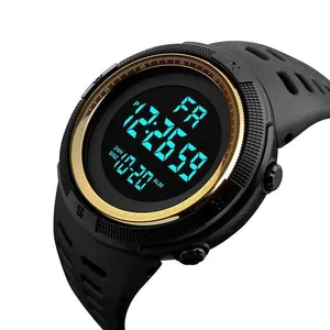 Close-up view of a men's digital sports watch with a gold bezel and black resin strap