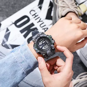 Close-up of a camouflage digital sports watch for men featuring a rugged outdoor design