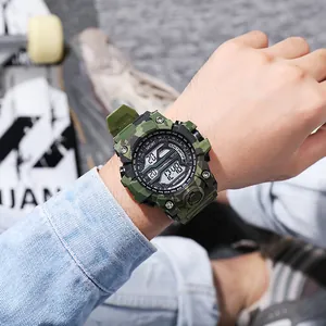 Outdoor men's camouflage digital sports watch worn on wrist in lifestyle setting.